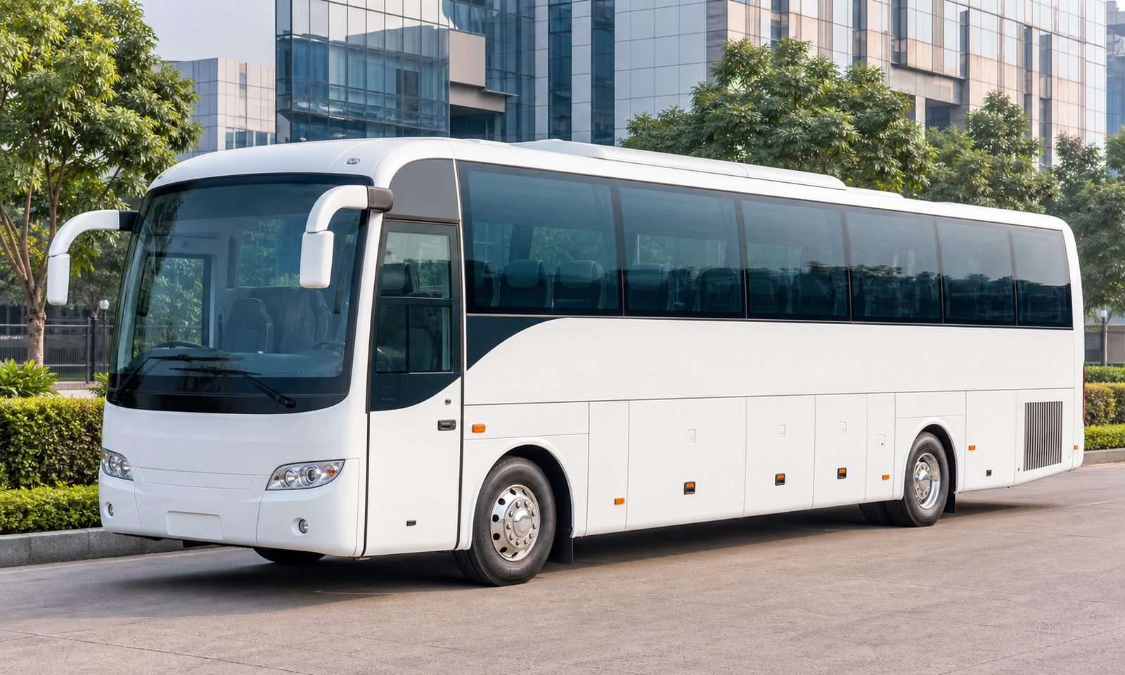 A modern white corporate passenger bus